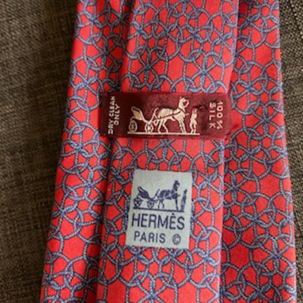 Hermes coral background / blue rope motif over the top men's  tie 100 % silk